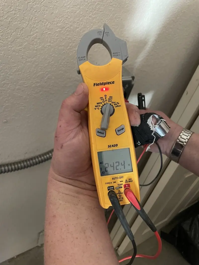 Voltage testing with clamp meter during Electrical Installation Services in Midland